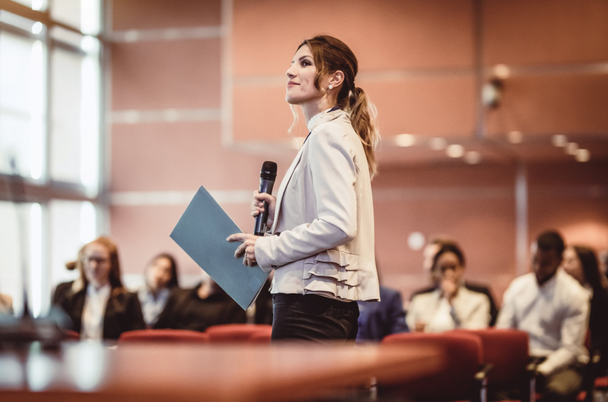 Business People Listening to the Speaker at a Conference