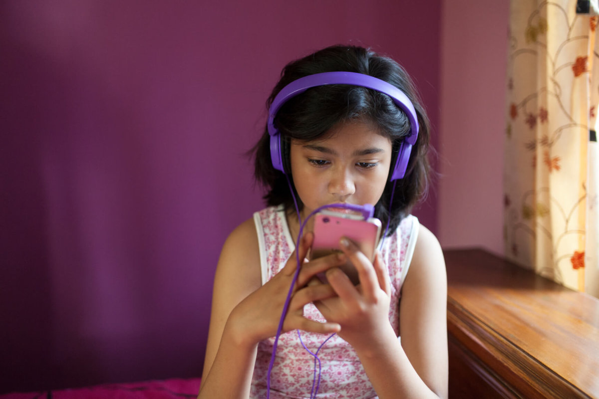 Teenage Girl Enjoying Music With Headphone