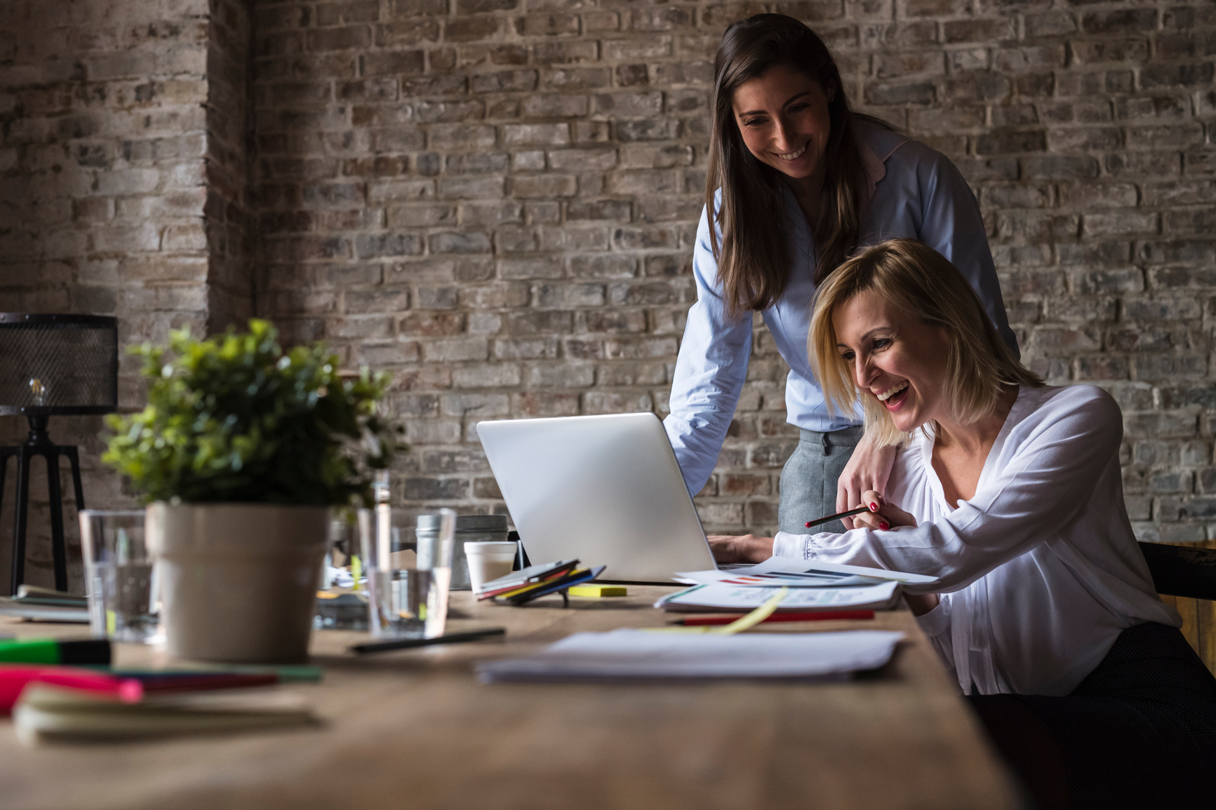Two Businesswomen Working In Office