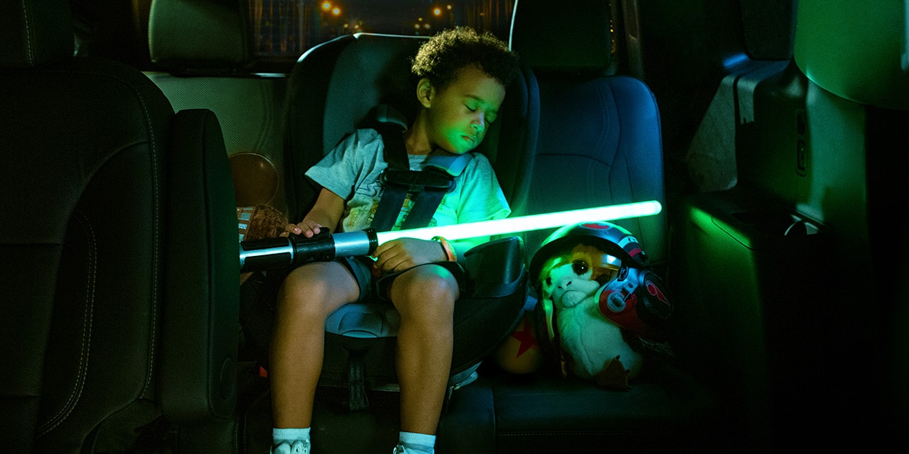 Disney print ad showing boy asleep in back seat; Credit: Yellow Shoes