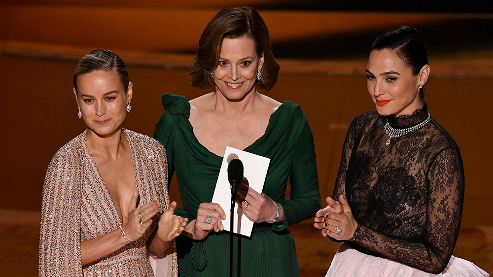 Brie Larson, Sigourney Weaver, and Gal Gadot at the Oscars; Credit: Rob Latour/Shutterstock