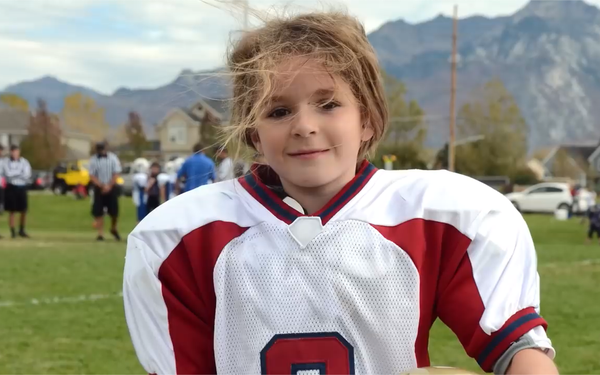 Young girl in football uniform