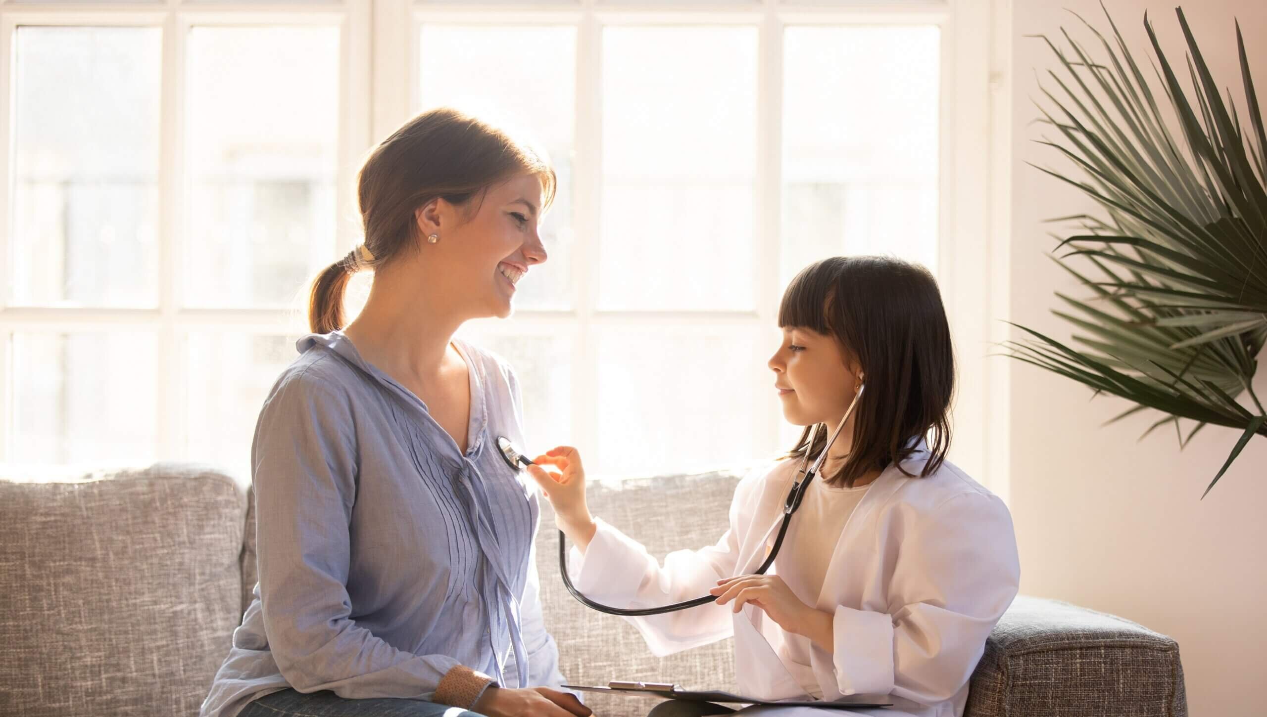 young-girl-plays-doctor-with-mother